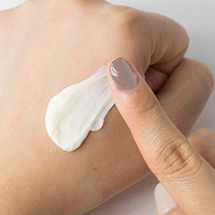 Small dab of Guerisson 9 Complex Cream ready for layering under makeup.