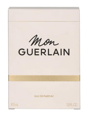Guerlain Mon Guerlain spray nozzle in action evoking lasting scent through the day