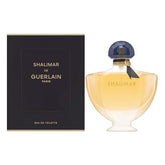 Guerlain Shalimar bottle close-up highlighting timeless luxury fragrance.