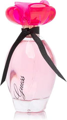 GUESS Girl bottle cap close-up emphasizes premium details perfect for gift-worthy presentation.