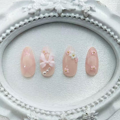 GXOIPNS bow pearl flower nail art closeup for a delicate, fashionable detail.