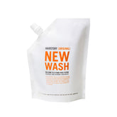 Hairstory New Wash Original Refill bottle pour demonstrates convenient, detergent-free cleansing for balanced scalp.
