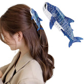 Hapdoo dark blue whale shark hair clip design in hand shows stylish nautical appeal.