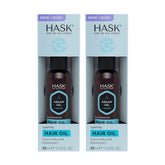 HASK Argan Repairing Hair Oil bottle with pump delivers easy application and shine.