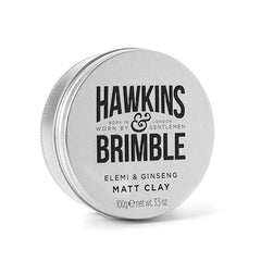 Hawkins & Brimble Matt Clay applied by hands to shape textured hair.