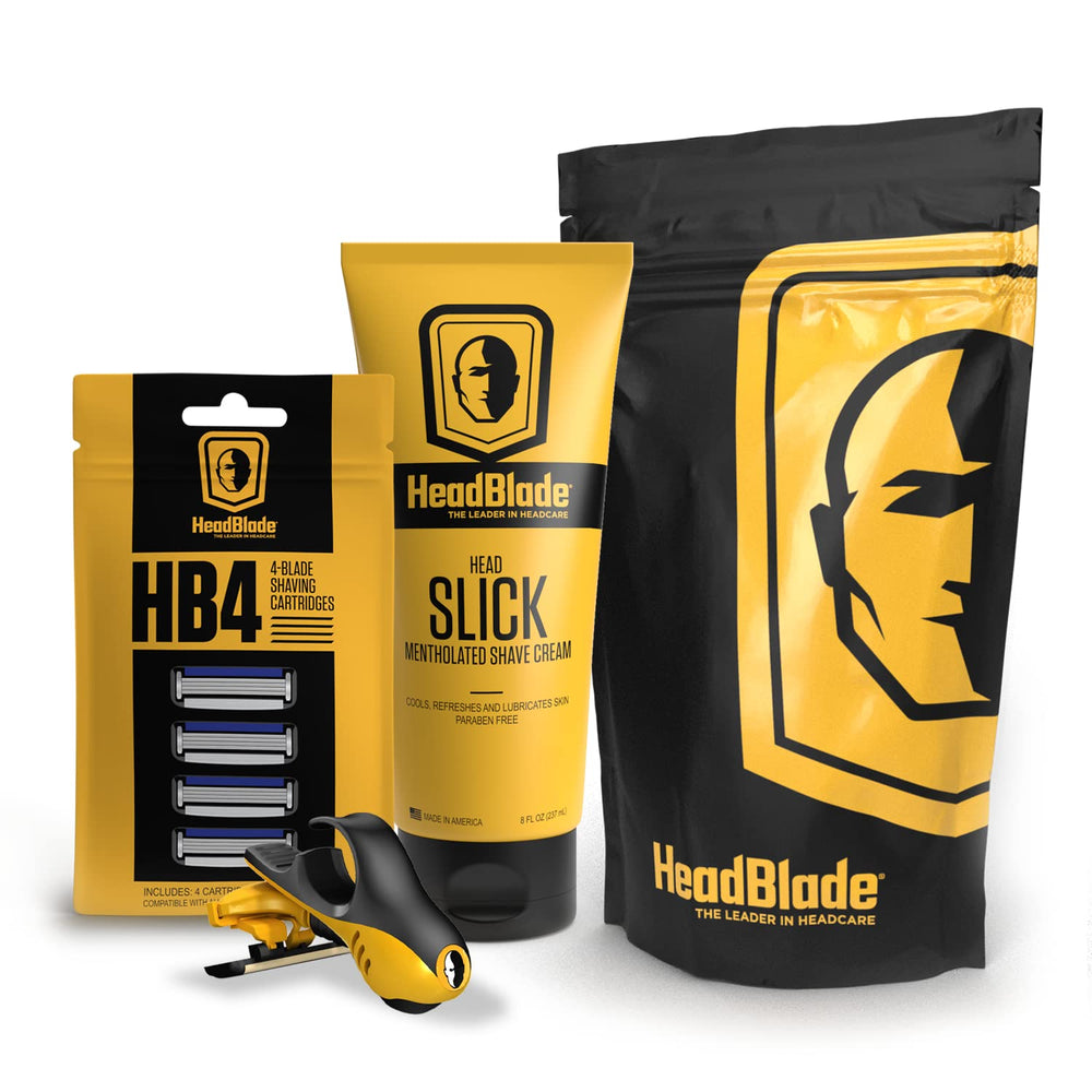 HeadBlade Moto razor in hand showing ergonomic grip for precise head shaving