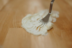 Creamy texture close-up of Hearth and Homestead balm ready for use