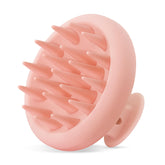 HEETA scalp massager closeup shows soft bristles for a gentle cleanse and relaxation.