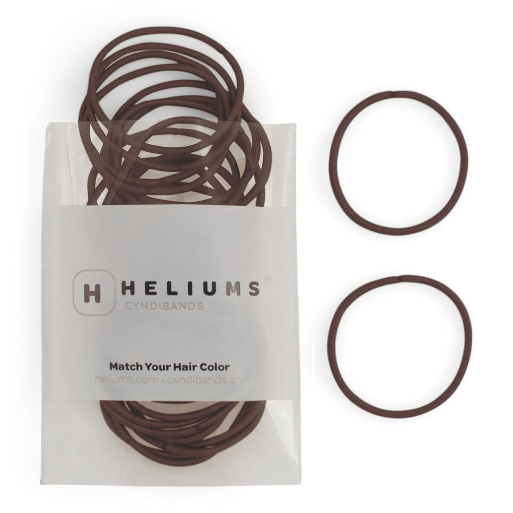 Heliums thin hair elastics dark brown 2mm closeup show gentle grip without snagging delicate hair.