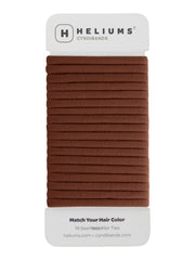 Heliums thin seamless hair tie in brown 6mm nylon offers gentle, snag-free hold.