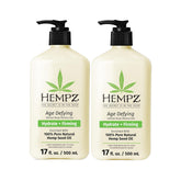 Hempz Age Defying bottle close-up highlighting deep hydration for daily skin care.