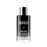 Herban Cowboy Dusk bottle closeup highlights smoky cedar for long-lasting evening confidence.