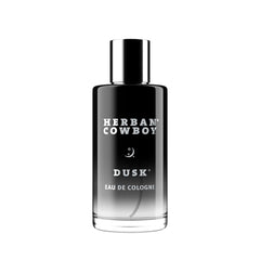 Herban Cowboy Dusk bottle closeup highlights smoky cedar for long-lasting evening confidence.