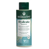 Herbatint Hydrate Shampoo bottle closeup showing deep moisture and gentle cleansing.