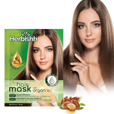 Herbishh Argan Hair Mask packaging shows a travel-friendly 25g jar for on-the-go care.