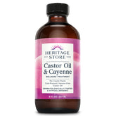 Heritage Store castor oil & cayenne bottle view illustrates cold-pressed oil for soothing abdominal care.