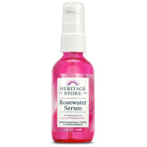 HERITAGE STORE Rosewater Serum bottle pours for deep hydration and dewy skin.