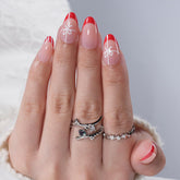 Herlight Christmas press on nails kit opened to show 32 nails in 16 sizes for perfect fit.