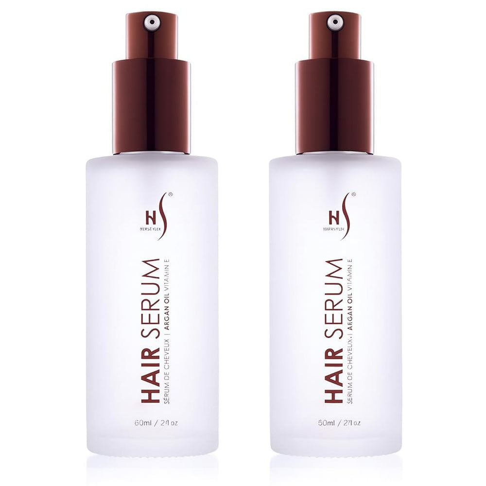 HerStyler Argan Oil Serum bottle closeup showcases lightweight shine boost for all hair types.