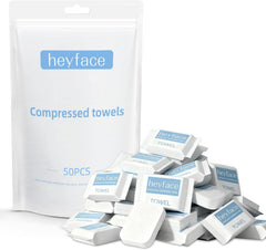 Heyface compressed towel tablet expands with water for quick facial cleansing.