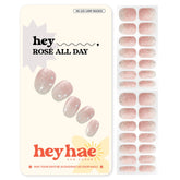 Heyhae semi-cured gel nail strips in rose champagne glitter for quick salon-quality manicures.