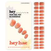 Heyhae semi-cured nail strips in orange ombre for salon-quality color under sun.