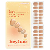 Heyhae Silent Night Sparkle strips close-up with gold glitter for easy at-home glam.