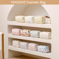 HHQQWZ makeup bag interior layout showing large storage pockets.