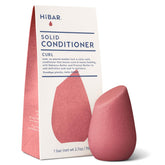 HIBAR Curl Conditioner Bar on wet hair for smooth application and hydration.