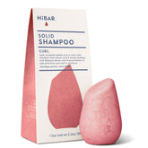 HIBAR Curl Shampoo Bar on wet hair defines curls and cleanses gently.