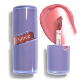 HINCE Raw Glow Lip Tint tube closeup delivers glossy stain with nourishing shine.