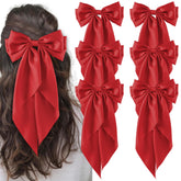 Hisial large bow hair clip red closeup, adds glamorous shine for special occasions.