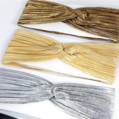 Hisight big bowknot headband in antique gold secures hairstyles at events.