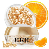 HKH Vitamin C serum capsules closeup, sealed for potent daily antioxidant care.
