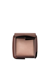 Hourglass Mini Dim Light compact closeup shows soft luminosity for refined glow.