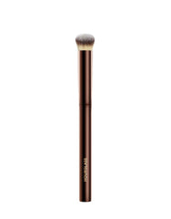 Hourglass Vanish Concealer Brush close-up showing precise, seamless blending for a flawless finish.