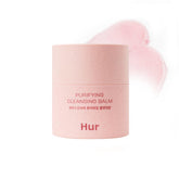 House of Hur Purifying Cleansing Balm jar closeup showing creamy texture for gentle makeup removal.