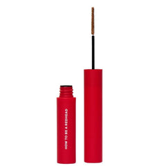 How to Be A Redhead brow gel brush applying on brows for easy tinting and shaping.