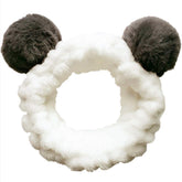Huachi panda ears headband closeup shows plush comfort for makeup and skincare routines