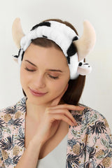 Huachi makeup headband in use during application with hair secured.