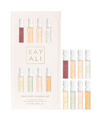 Huda KAYALI Discovery Layering Set with eight 1.5 mL samplers for travel-friendly scent exploration.