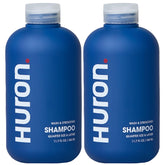 Huron Clean Citrus Woods shampoo bottle promotes sulfate-free nourishment for daily refreshment.