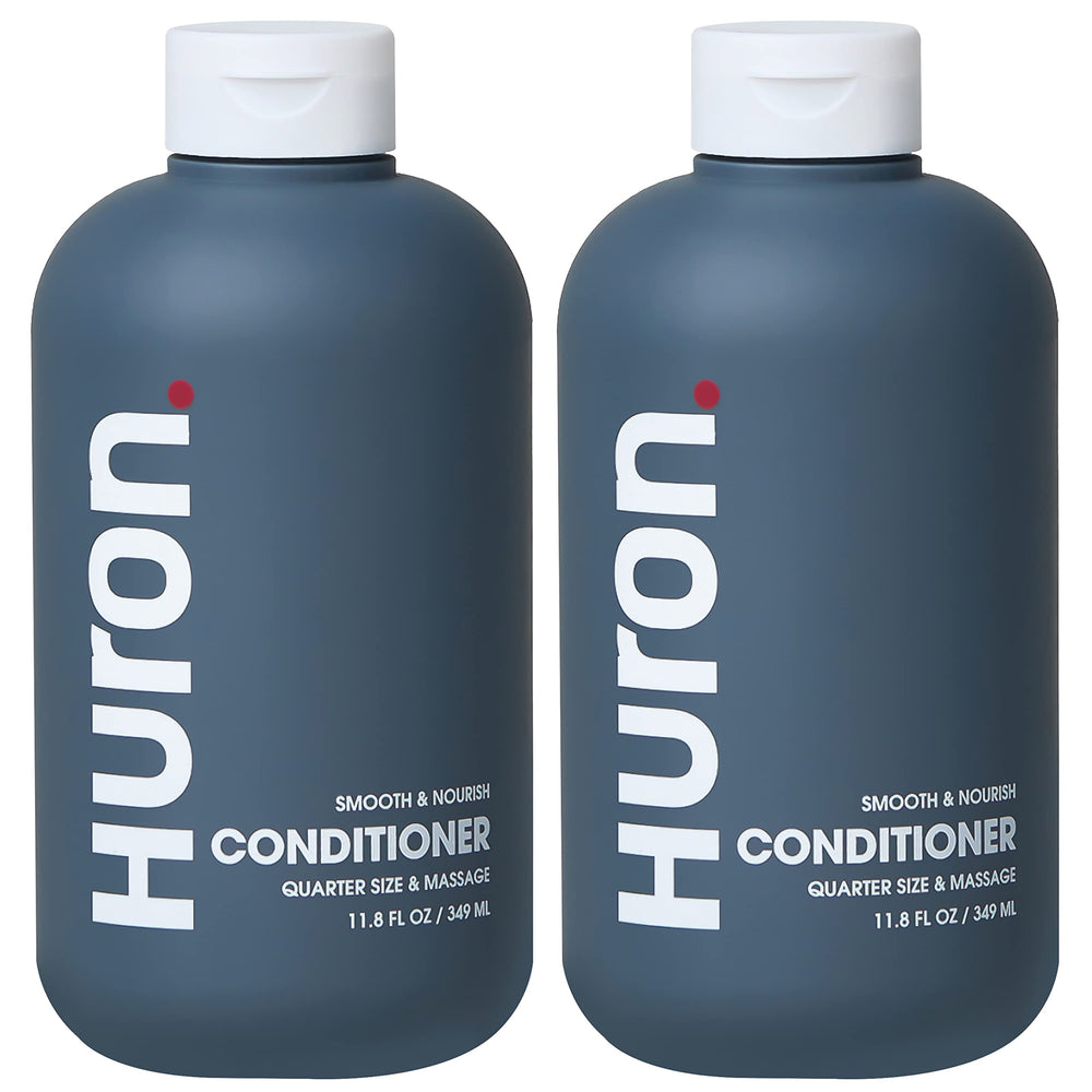 Huron Men’s Conditioner bottle closeup shows lightweight, hydrating formula for frizz control.