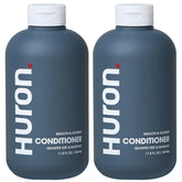 Huron Men’s Conditioner bottle closeup shows lightweight, hydrating formula for frizz control.