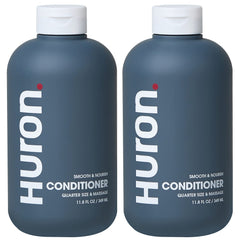 Huron Men’s Conditioner bottle closeup shows lightweight, hydrating formula for frizz control.