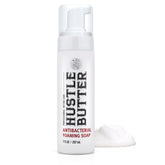 Hustle Bubbles tattoo aftercare soap bottle demonstrates gentle cleansing for new tattoos.