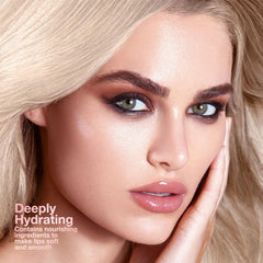 IATMOMOD pink-cherry-nude-tinted-honey lip balm closeup emphasizes nourishing moisture.