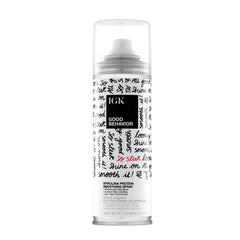 IGK GOOD BEHAVIOR spirulina smoothing spray bottle close-up for salon-like shine.