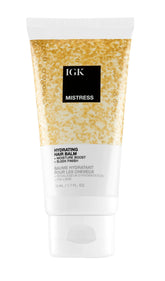 IGK Mistress travel balm tube for on-the-go hydration and frizz control