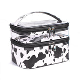 Imerelez cow print makeup bag top view showing organized, spacious interior for cosmetics.
